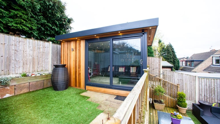 Small garden room within small neat garden