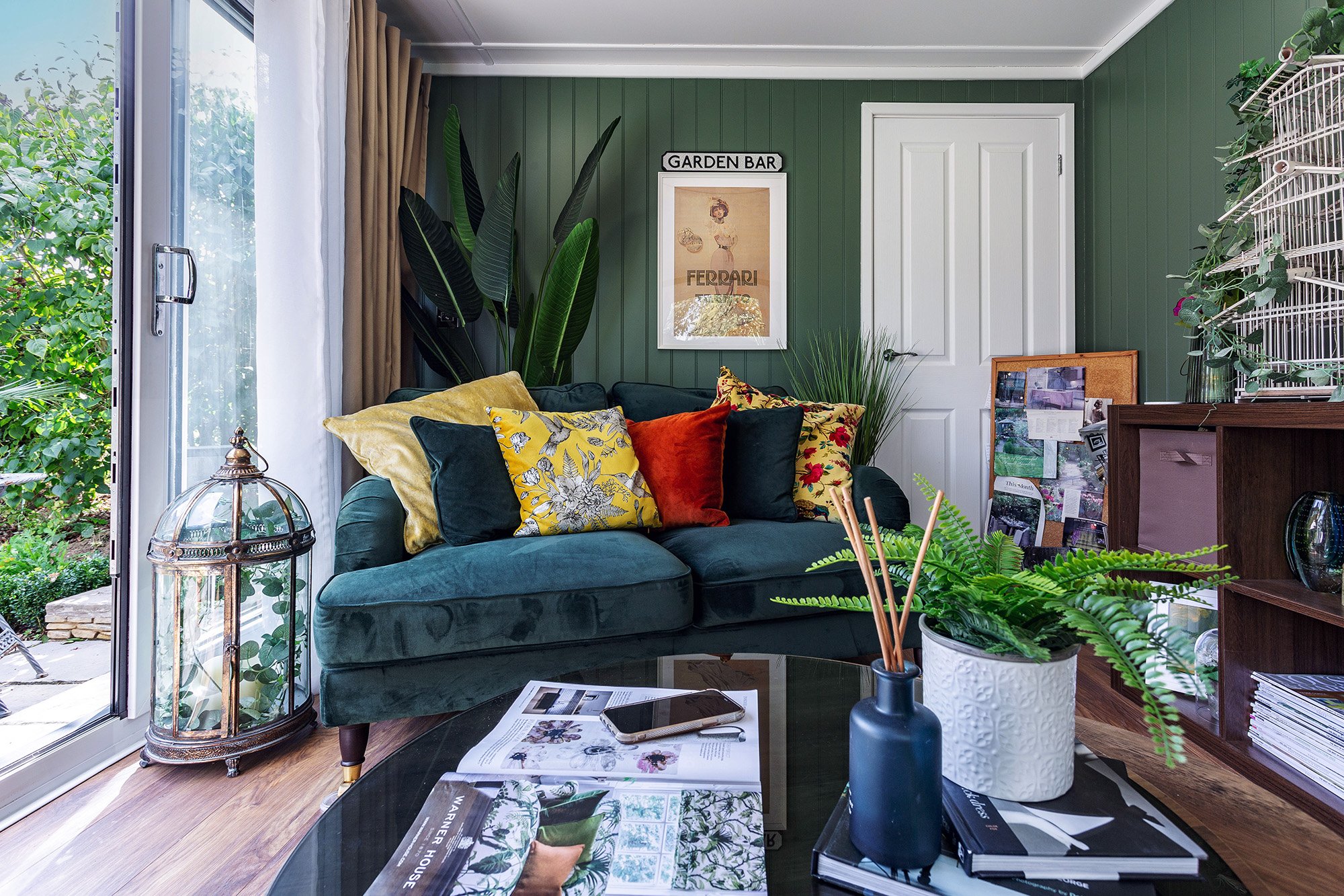 Interior of a Cosy Garden Room with comfy seating and tropical plants