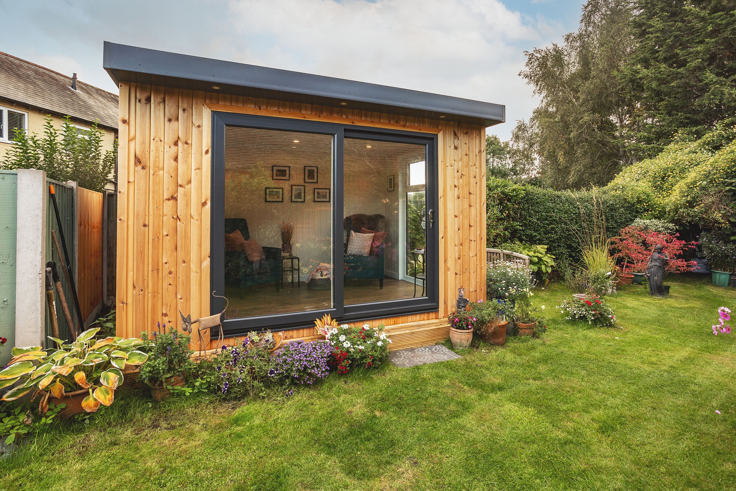 External shot of a luxury redwood garden room office