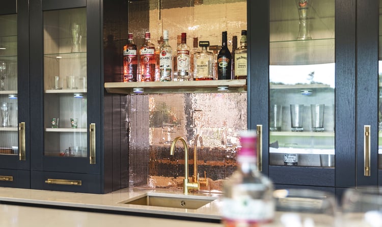 Inside a Garden Office kitchen area with sink and sparkly splashback