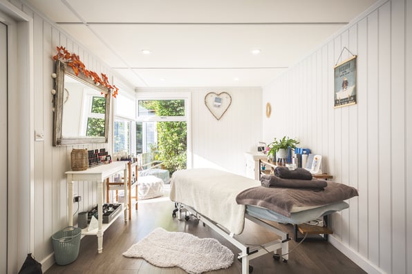 Interior of a garden home therapy room with couch, products and decor