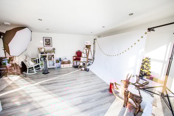 Interior of a Photography Studio in Garden with backdrop, lighting and props