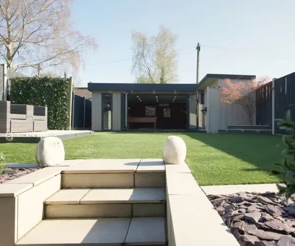 7m x 6m bespoke garden games room with contemporary Marley Board cladding.