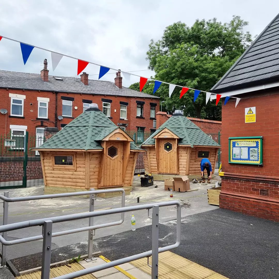 two school outdoor classrooms on playground