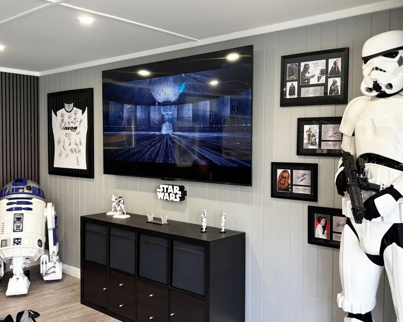 Star Wars themed man cave with games area and contemporary interior design.