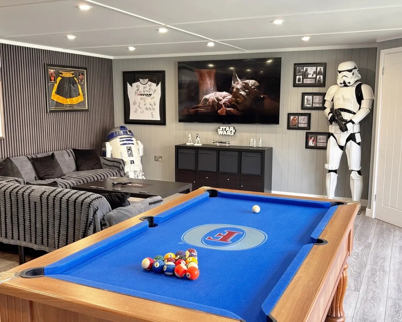 Spacious Star Wars themed garden bar with pool table, seating area and entertainment space.