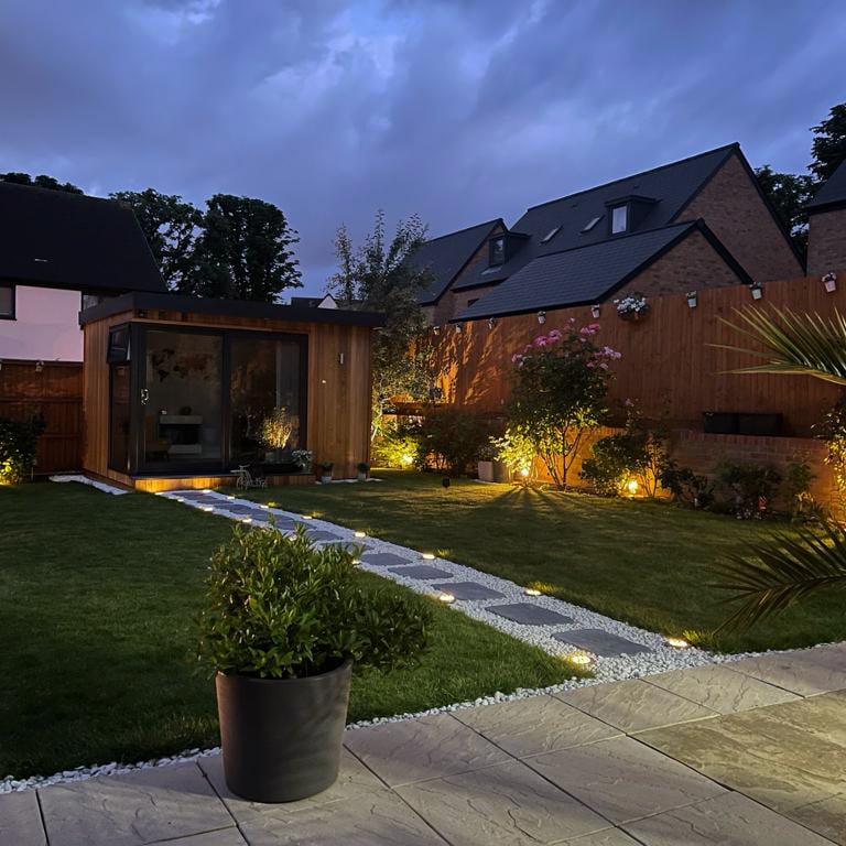 garden golf sim cabin at night