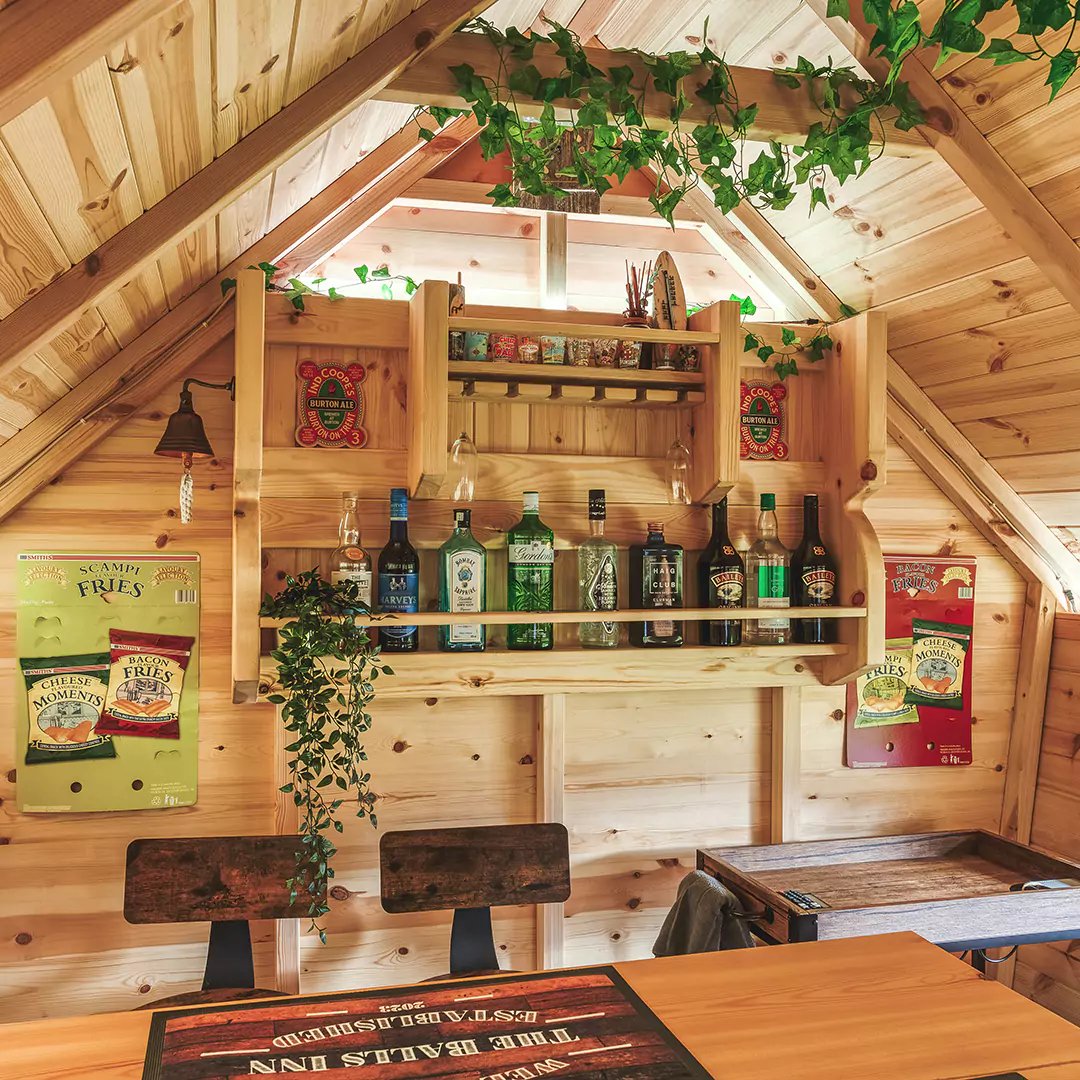 The inside of a cosy, rustic bbq grill cabin with bar