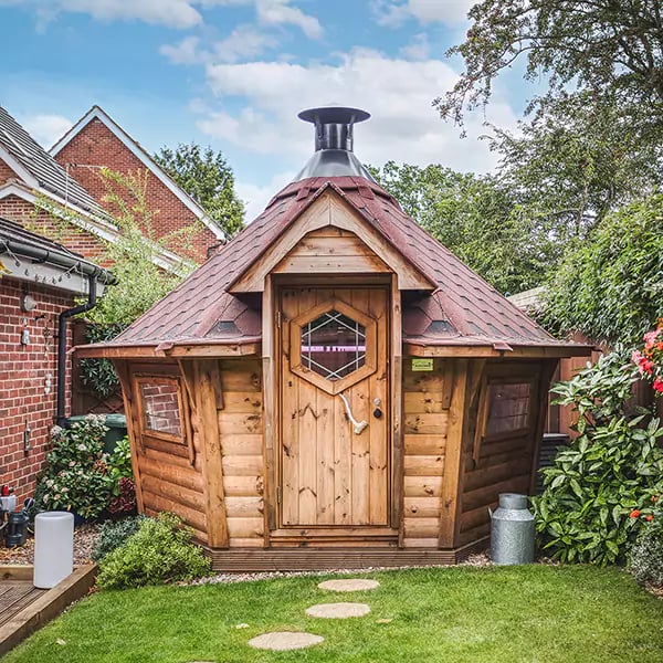square on view of a small arctic cabin bbq house