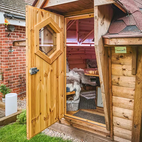 looking in through the door of a bbq cabin