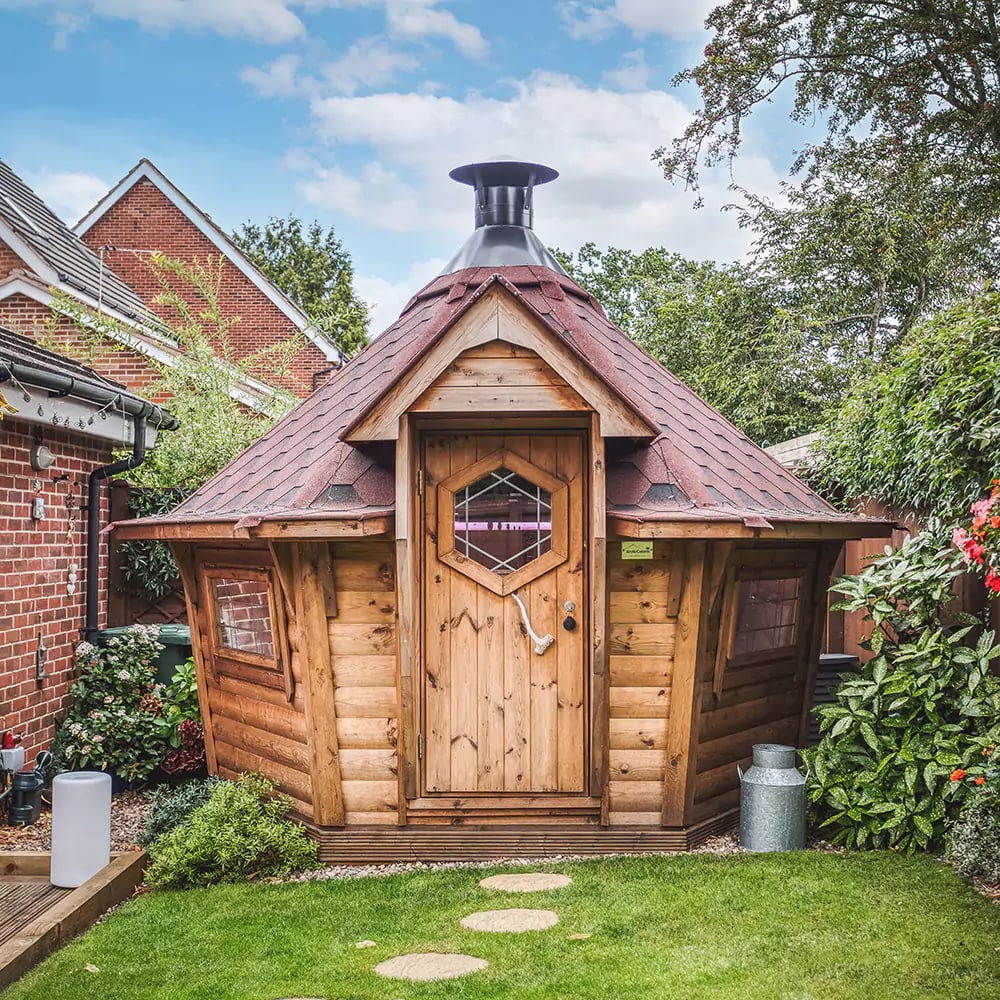 10m Arctic BBQ Cabin with black roof in garden