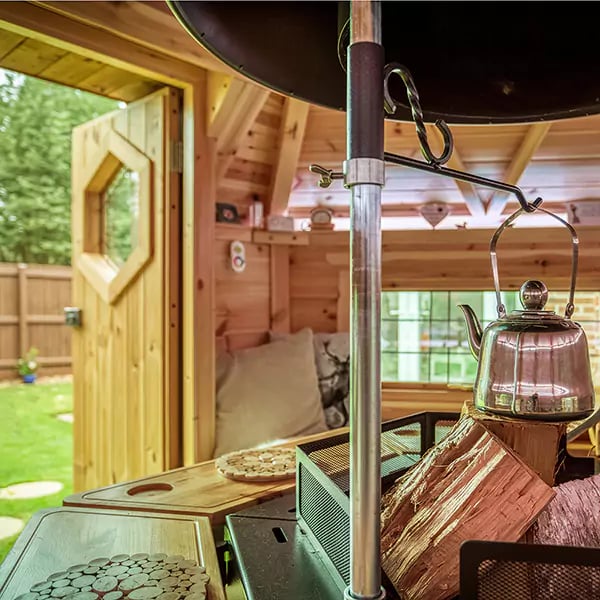 small bbq hut for the garden looking out from door