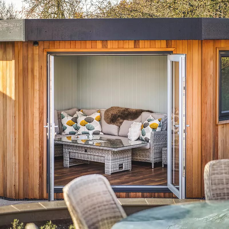 looking inside a garden room clad in premium cedar