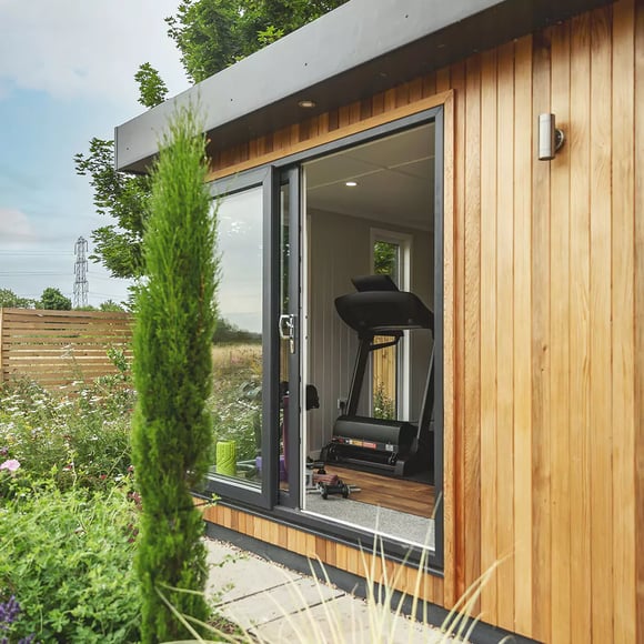 Luxury Garden Office built in cedar with black framed doors and windows