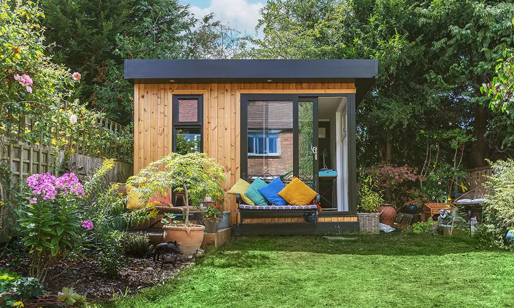 small insulated garden office micro office with seating outside