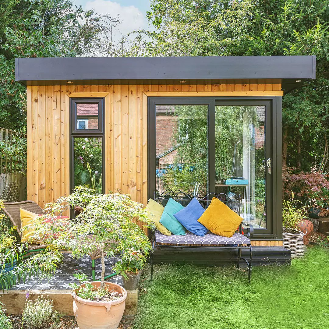 Small insulated garden office with bright accessories