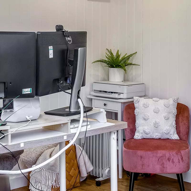 desk and chair inside garden office
