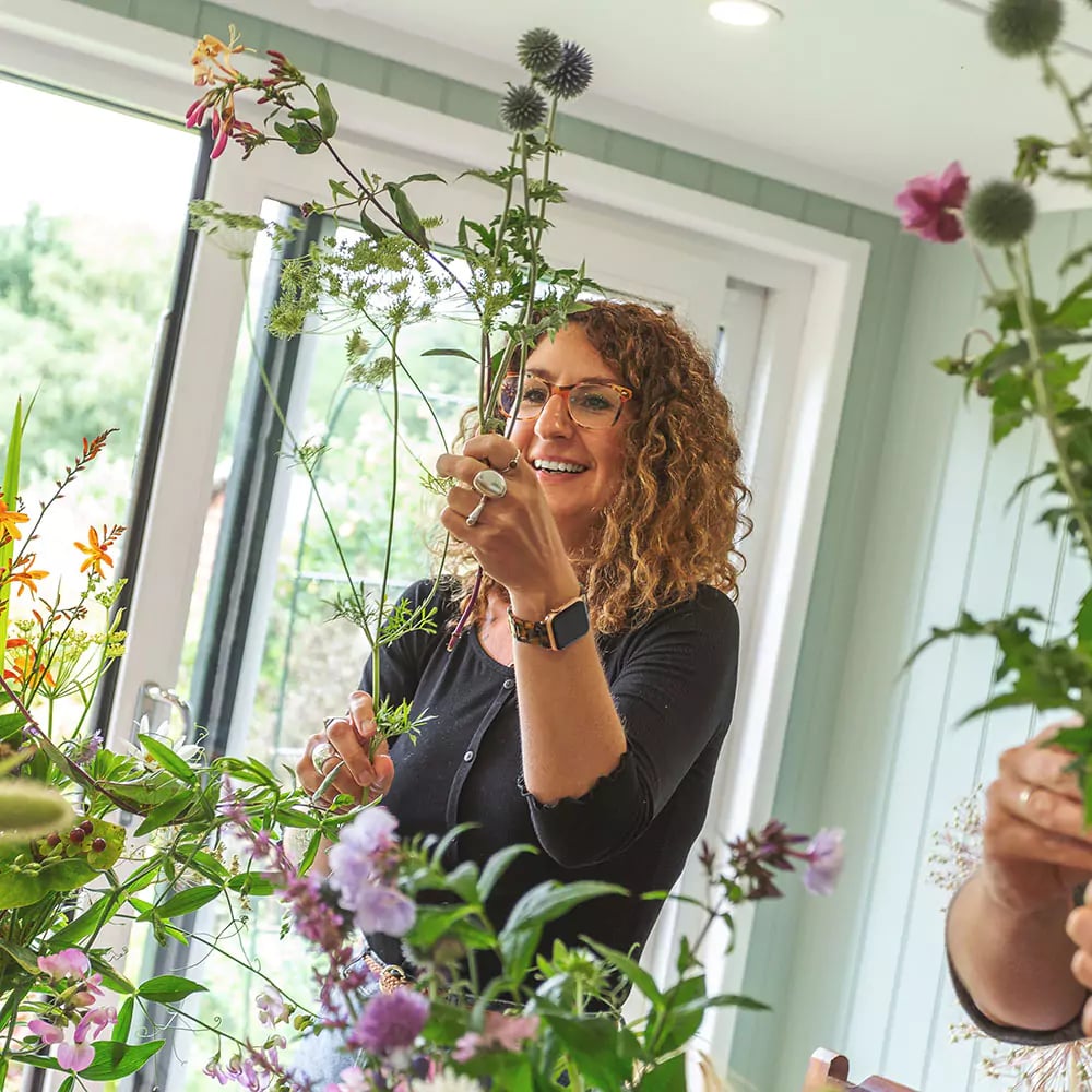 Interior of a garden studio with a floristry workshop taking place