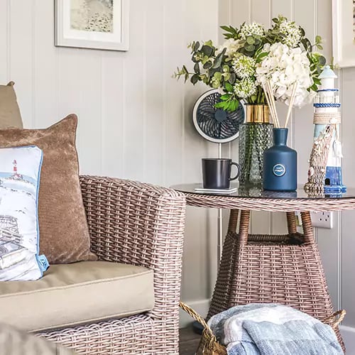 Table styling detail inside a seaside themed summerhouse
