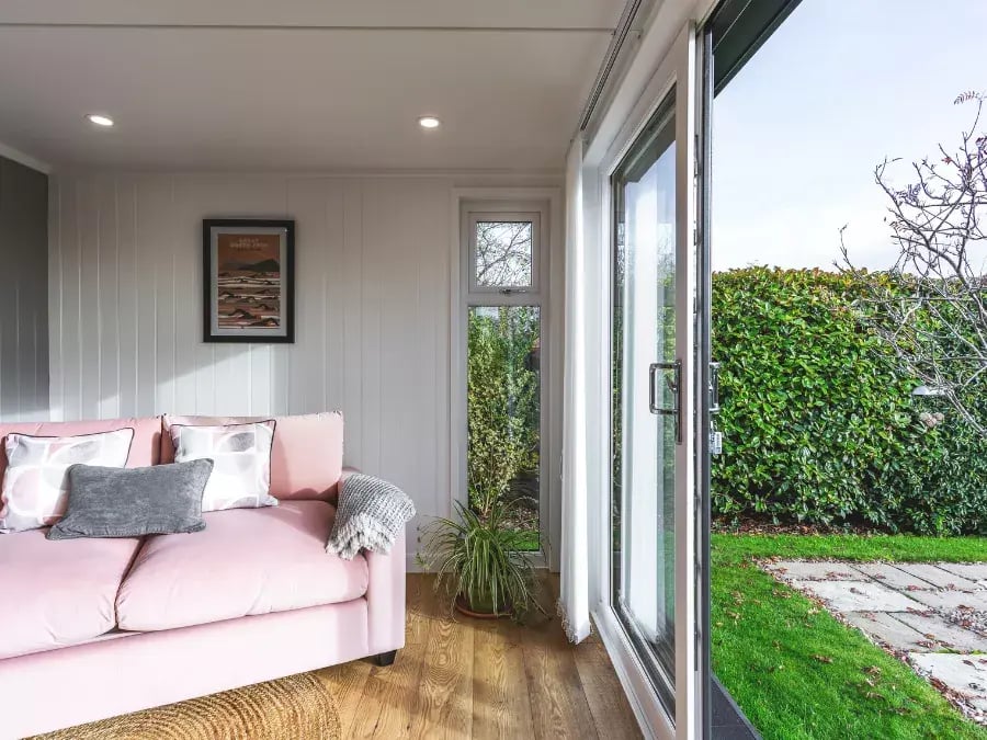 garden room with pink sofa