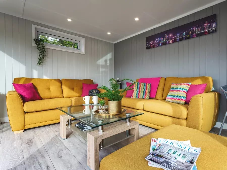 yellow sofas inside garden room