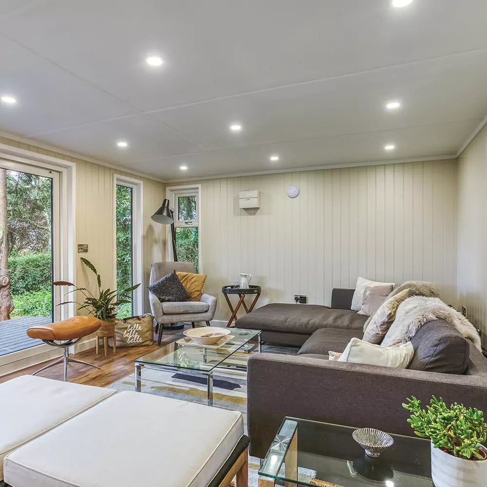 interior of a garden room music studio with sofa area