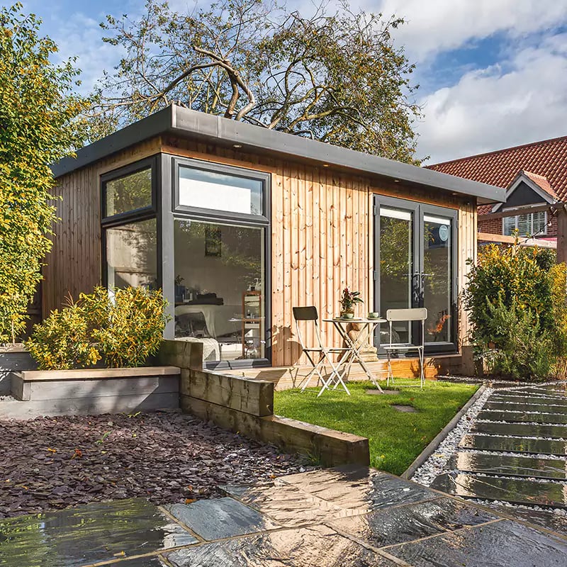 Shot of a garden spa room with a board outside
