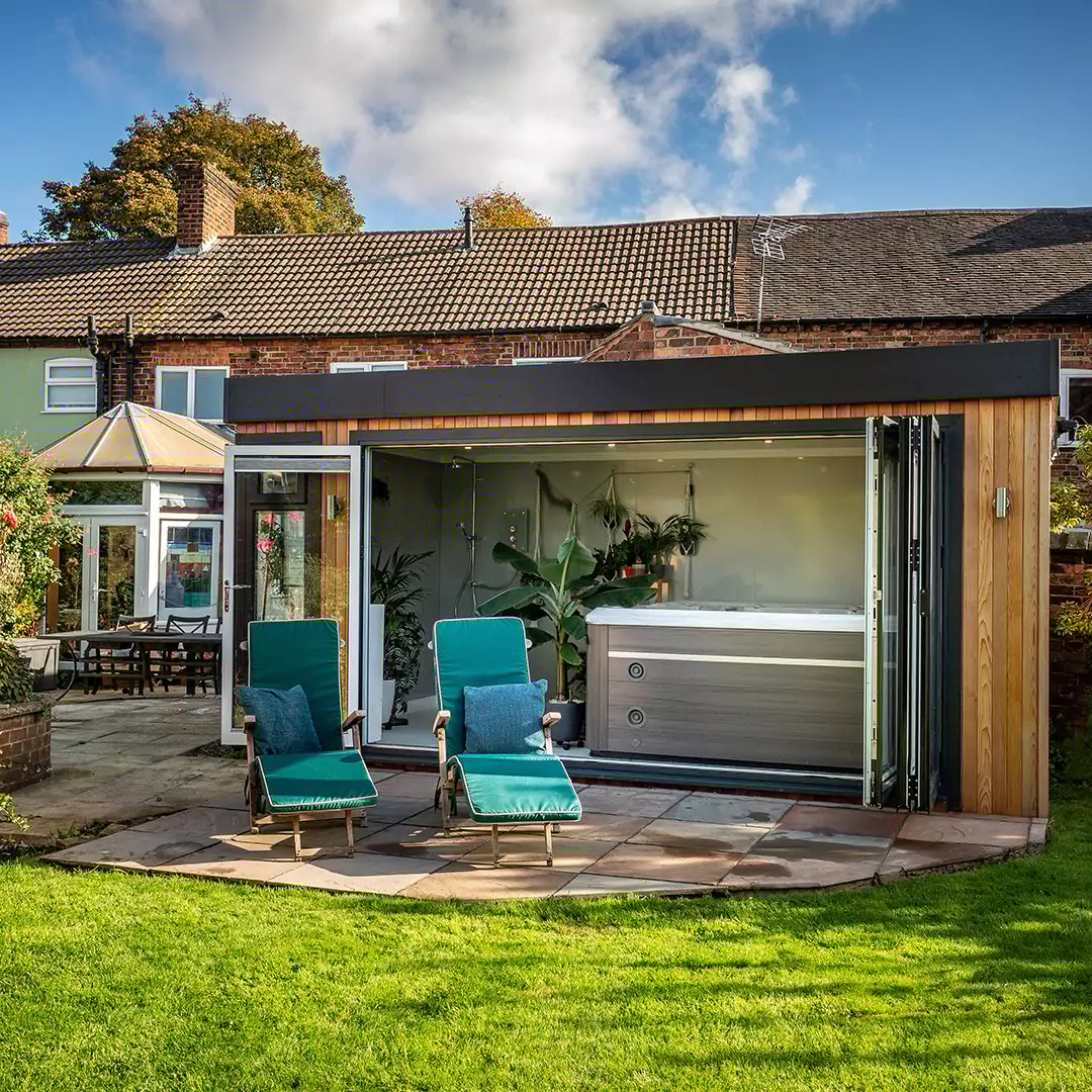 Exterior of a garden spa & beauty room with hot tub inside