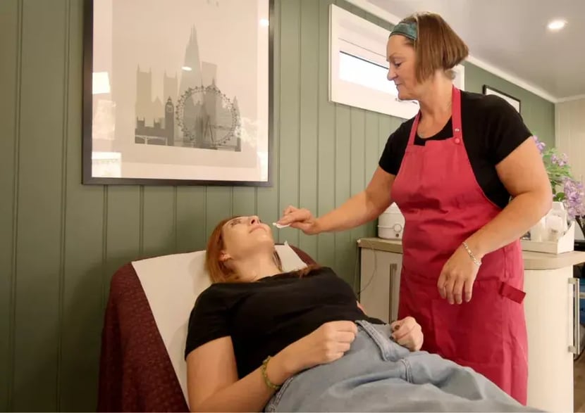 beauty therapist working in a garden studio