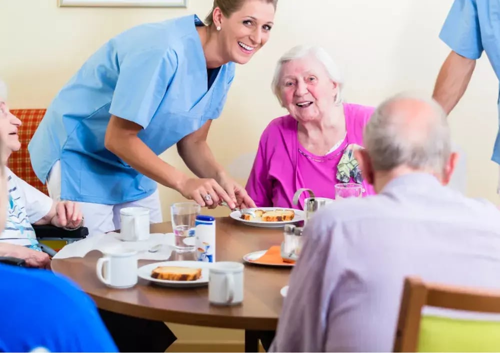 care home worker with elderly residents