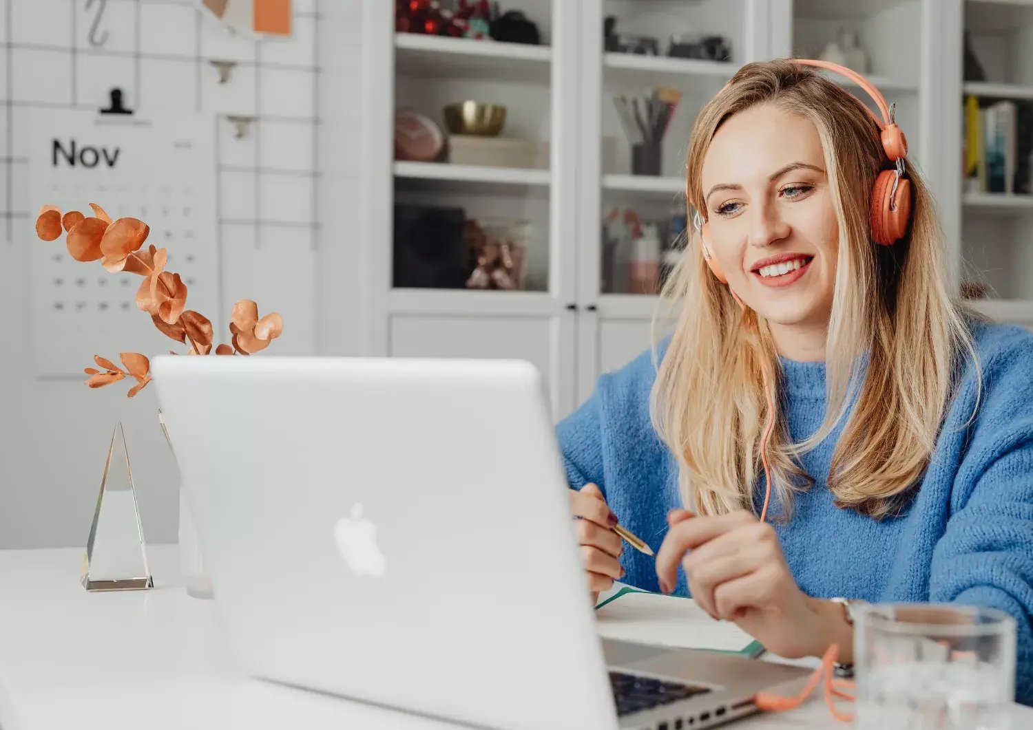 online design meeting person on laptop with headphones on