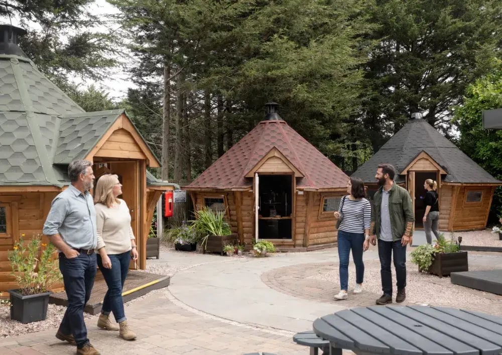 customers walking around the nottingham garden room show site for cabin master