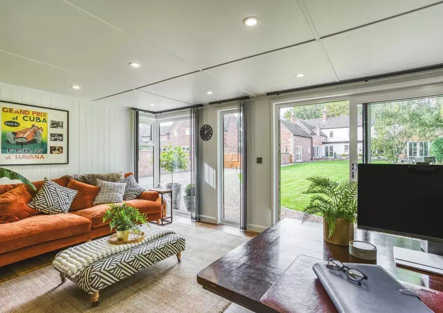 sofa and office area inside garden room