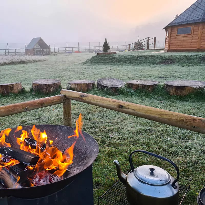 firepit outside Happy Homestead Eco Nursery Forest School Outdoor Wooden Cabin