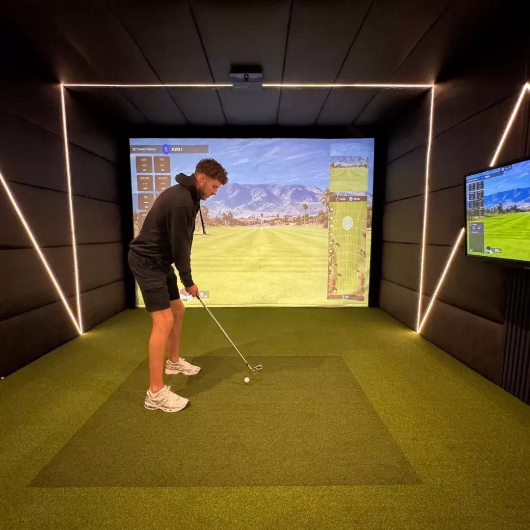 inside a golf sim cabin for the garden