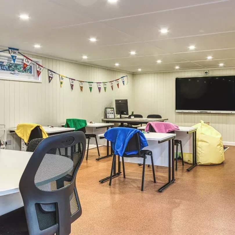 school cabin with interactive white board on wall