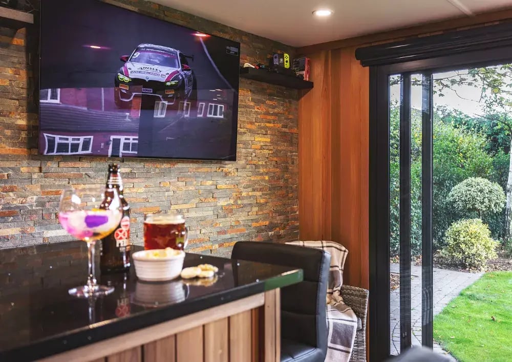 garden bar with tv on wall