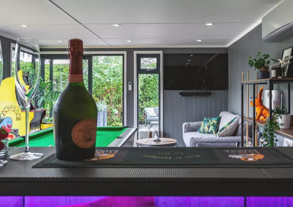 looking out from behind the bar inside a garden room bar