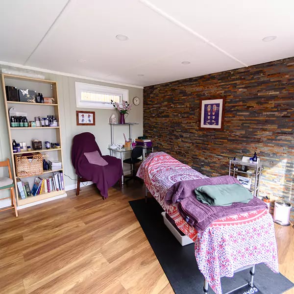 inside view of redwood garden rehabilitation room with gym equipment and mat area