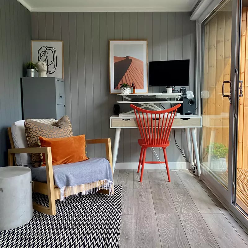 garden gym and small home office room with orange chair and desk with cabinet