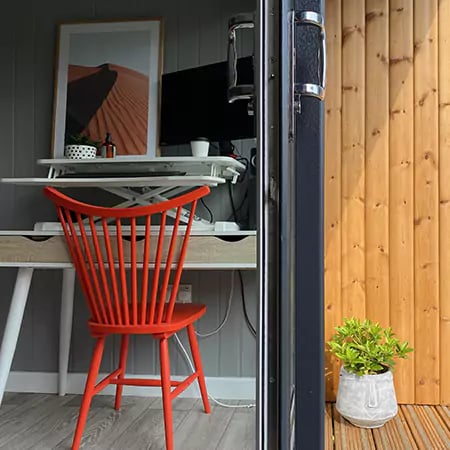 garden room small home office and gym with patio walkway and large lawn area 