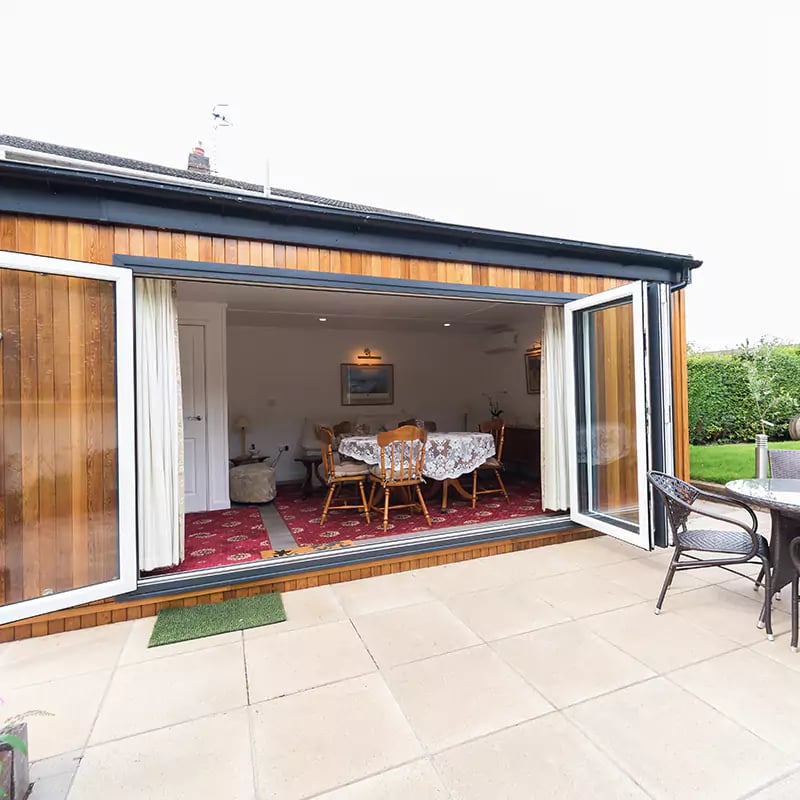 garden room with bifolds open 