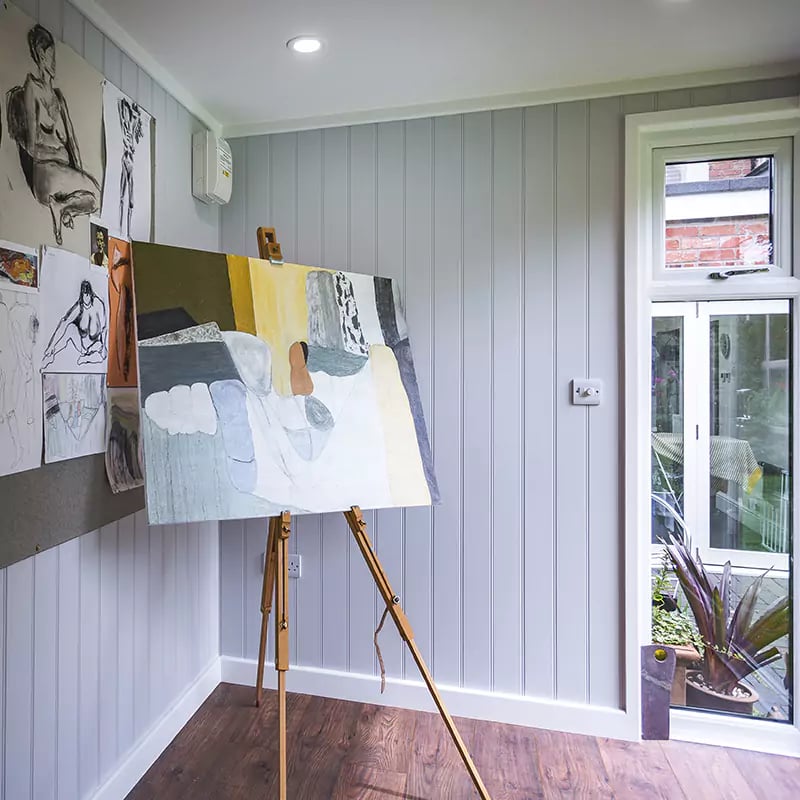 Interior of a garden artists studio with desk & shelving