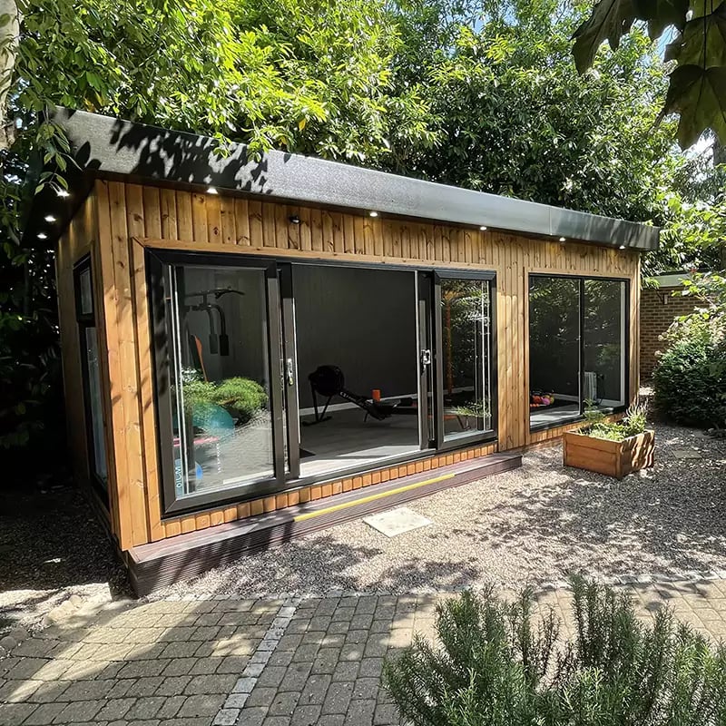 Large Redwood Gym on Nottingham Show Site with planters and lavender alba plants with sliding glass doors open