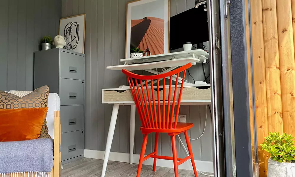 Small garden office shed interior with bright attractive furniture