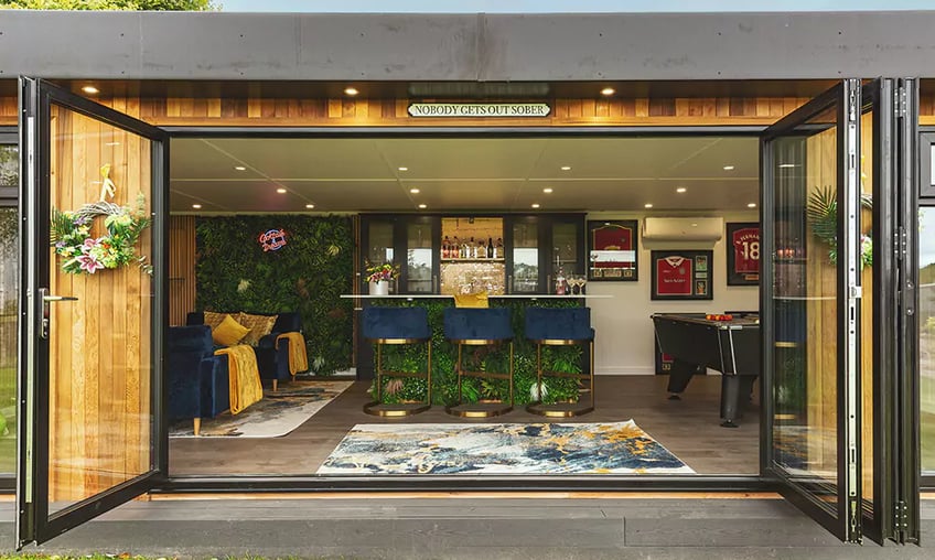 looking inside a garden bar through open bifolds