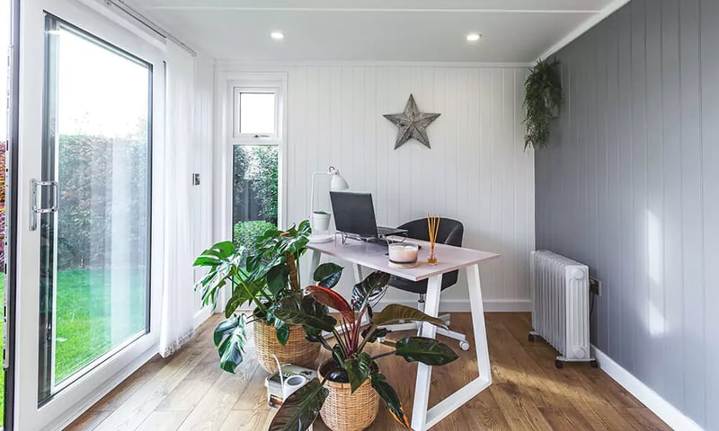 Home office in the garden with desk and chair