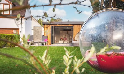 luxury garden room with bifold doors open