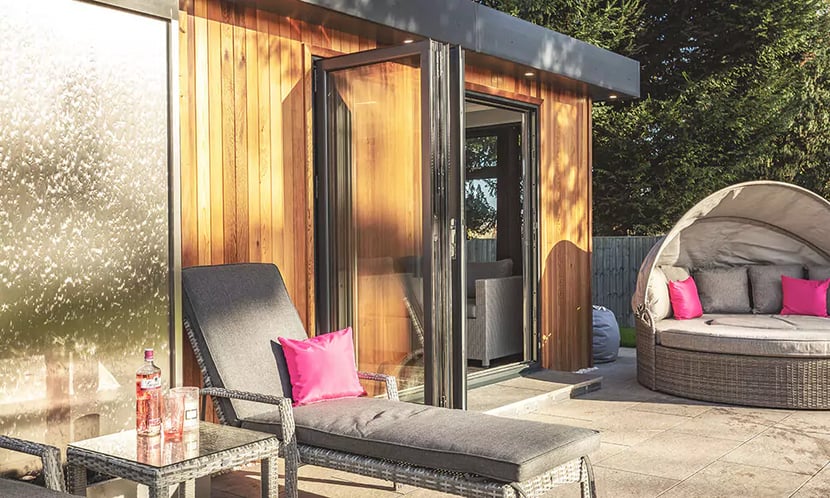 Timber redwood garden room in very large impressive garden