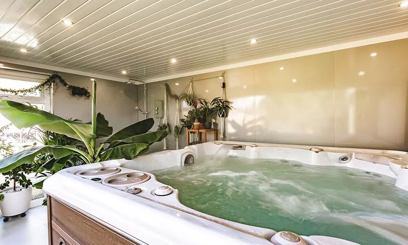hydropool hot tub in garden room